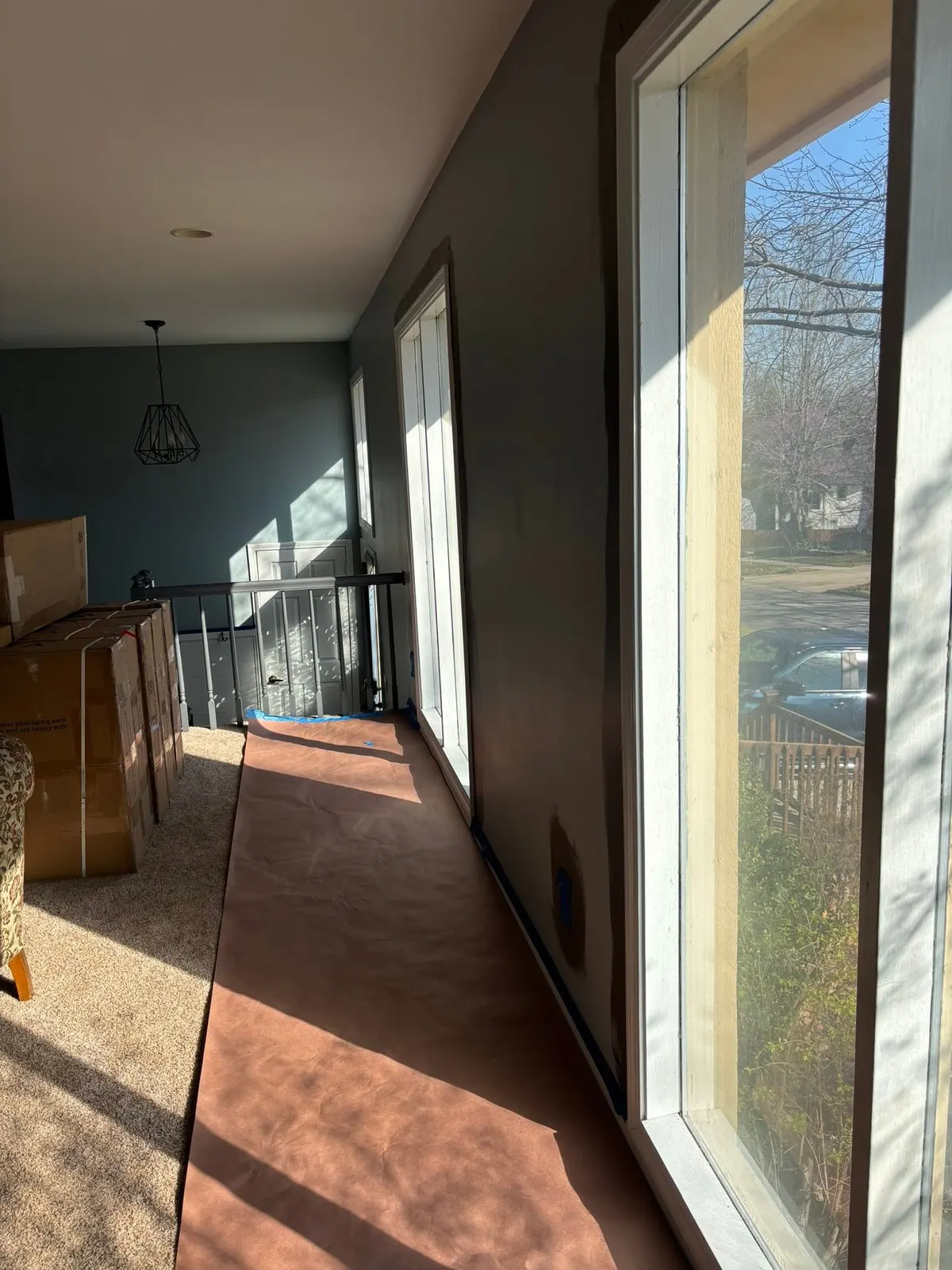 Upper hallway beside a large window